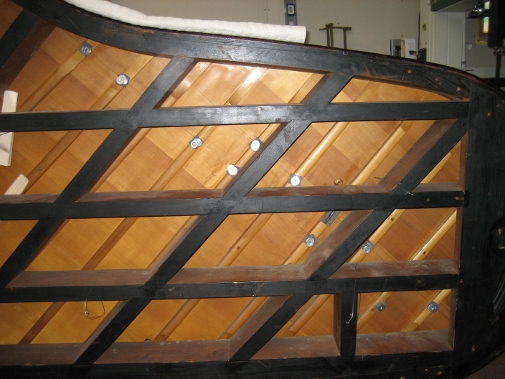 Repairing Rib Separation. Piano rests on its side.